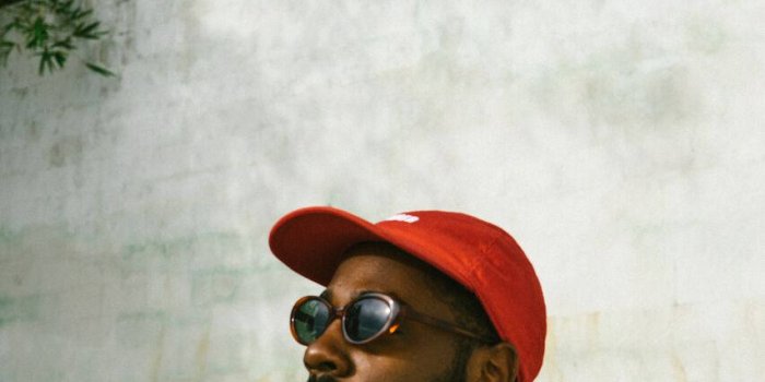 853x1280 Download Brent Faiyaz Red Cap Wallpaper