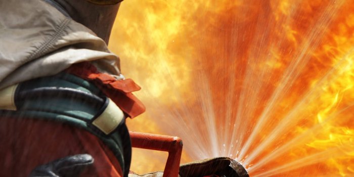 1080x1920 Firefighters Using Fire Hose Wallpaper