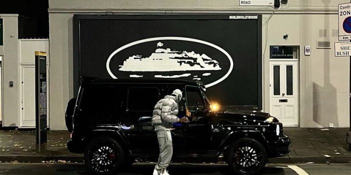 828x1013 Man Standing Next to a Black Truck at Night