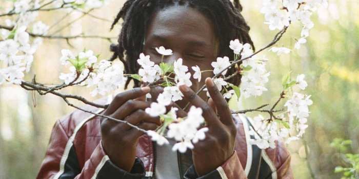 1273x1920 Download Daniel Caesar Smelling Flowers