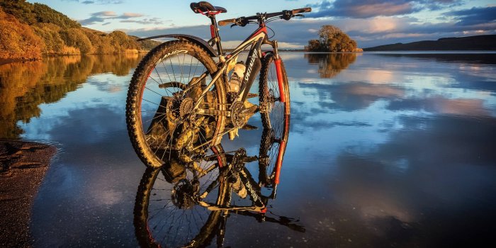 1920x1200 Mountain Bike Near River Wallpaper