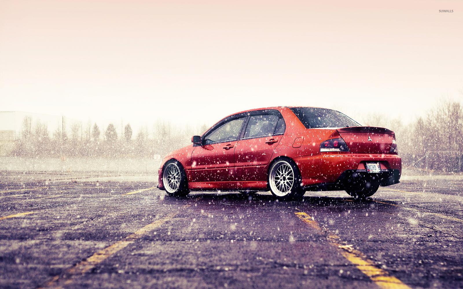1920x1200 Mitsubishi Lancer Evolution on a rainy
