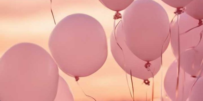 720x1280 Light pink balloons floating against a