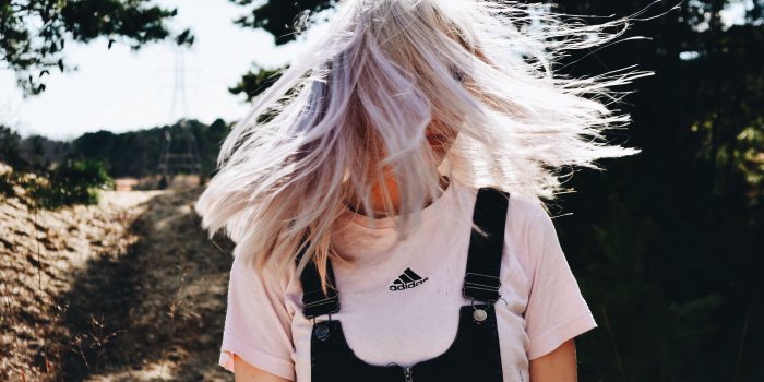 4928x3264 woman in black and white adidas shirt standing on the road free