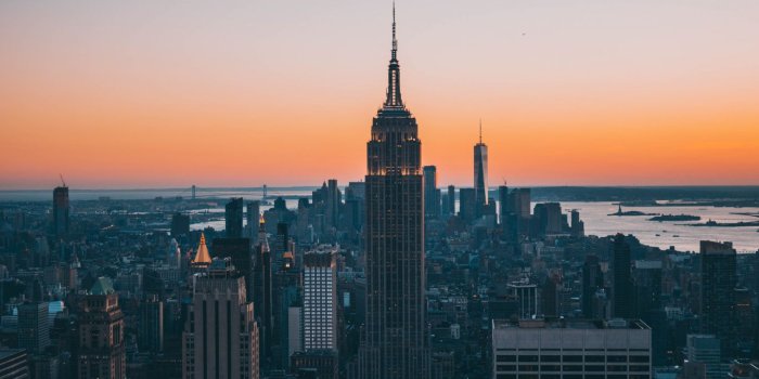 1366x768 Download 1366x768 wallpaper empire state building, buildings, sunset