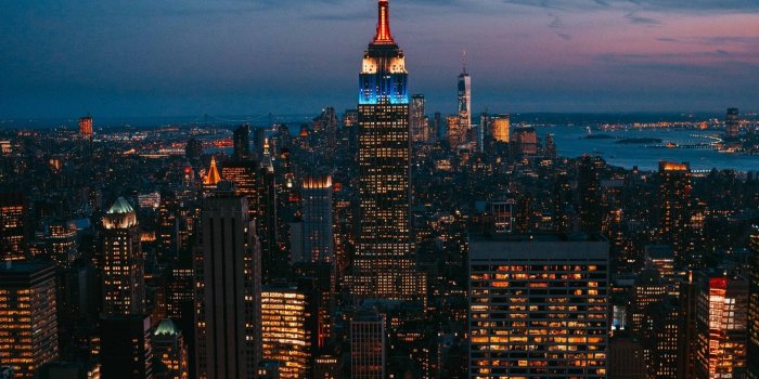 1366x768 Download wallpaper 1366x768 night city, city lights, skyscraper, new