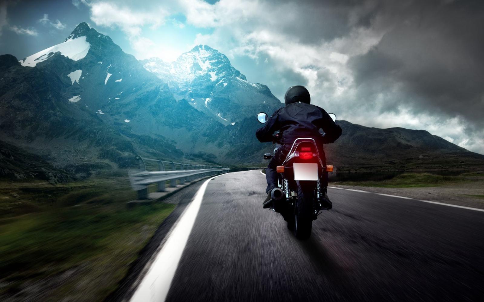 1680x1050 Download desktop wallpaper Biker on the road