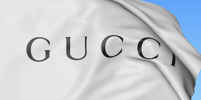 1920x1080 Close-up of waving flag with Gucci logo, seamless loop, blue background,  editorial animation. 4K ProRes Stock Video Footage - Storyblocks Video