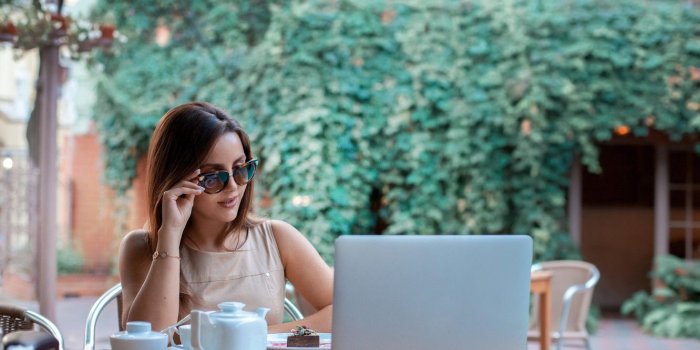 1332x850 Wallpaper girl, pose, tea, makeup, glasses, hairstyle, laptop, brown