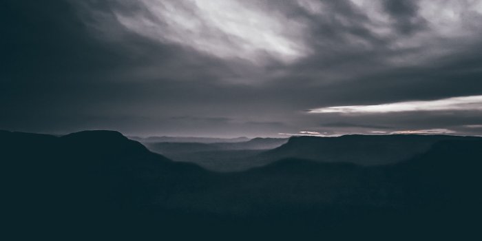 2560x1080 Download wallpaper 2560x1080 mountains, clouds, dark, national park