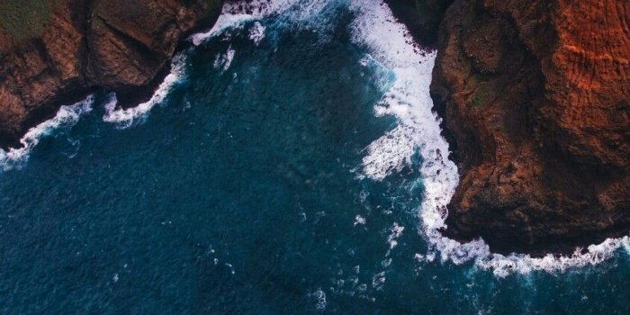 844x1500 Crashing waves on a rough dark cliff edge. | Photography | Mobile