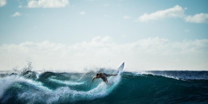 5004x2815 Person Riding on White Surfboard Doing Surfing · Free Stock Photo