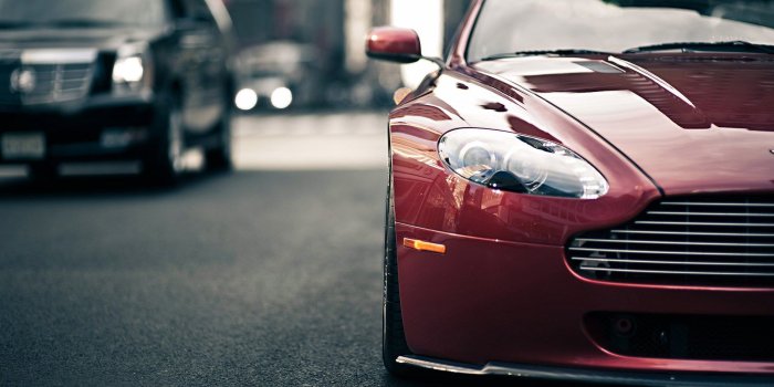 1920x1200 Aston Martin V8 And Cadillac Escalade Vantage Traffic Desktop Wallpaper