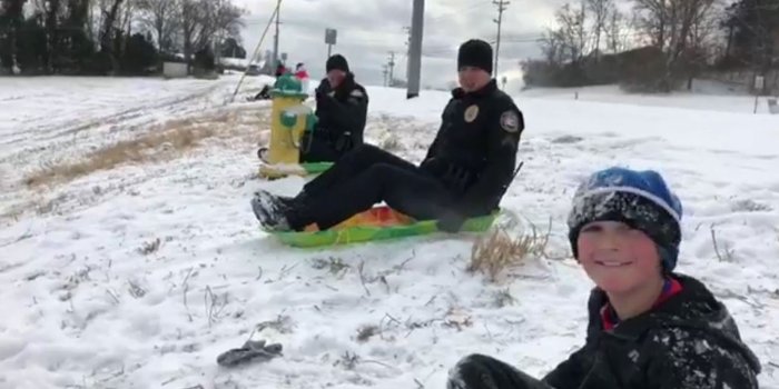 1600x900 Snow day fun: Police challenge kid to sled race