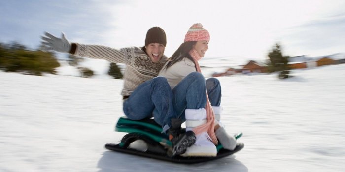 1332x850 Wallpaper girl, the sun, snow, day, pair, guy, sled, the mountain