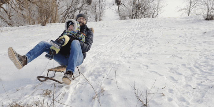 1920x1080 Slow Motion: Happy father and son moves down on sled, family sleigh ride  through snow, sledding down hills. Fun winter holidays Stock Video Footage  -
