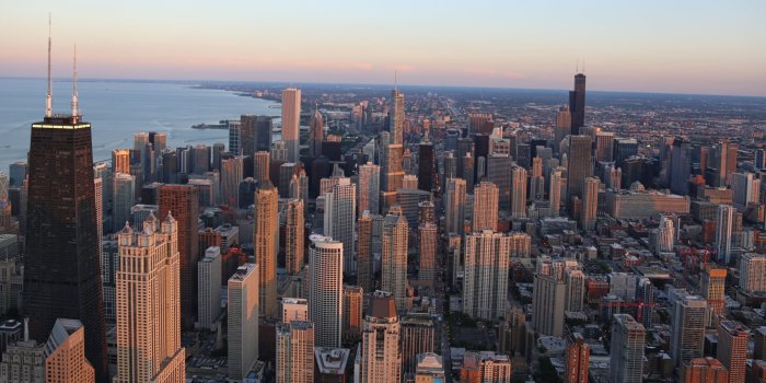 5181x2315 Aerial photography of city building near ocean during day tim