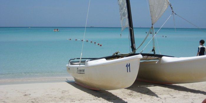 2591x1460 Catamaran on the Beach : wallpaper