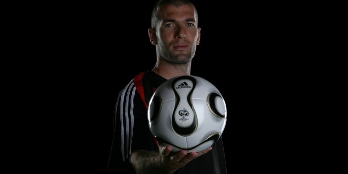 2560x1600 Soccer player holding white adidas soccer ball HD wallpaper