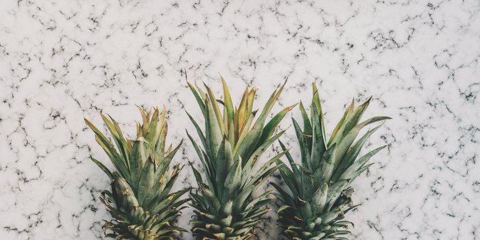 6000x4000 3 Pineapple Fruit on White and Grey Sand · Free Stock Photo